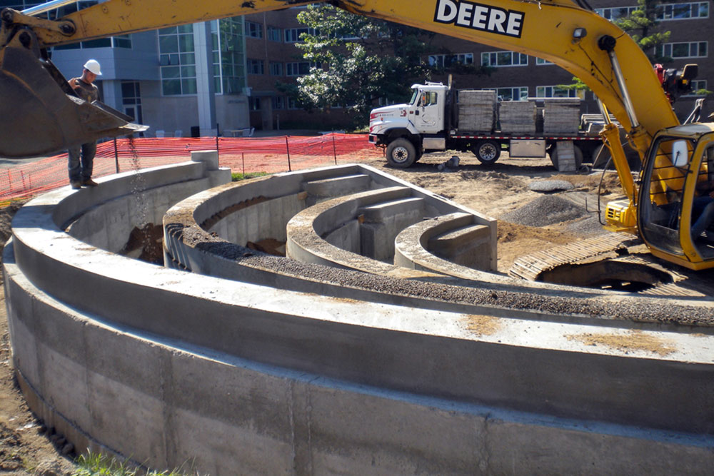 Concrete sidewalks, curbsides, basketbell courts and amphitheatre  and  at MSU Bailey Hall by Moore Trosper Construction