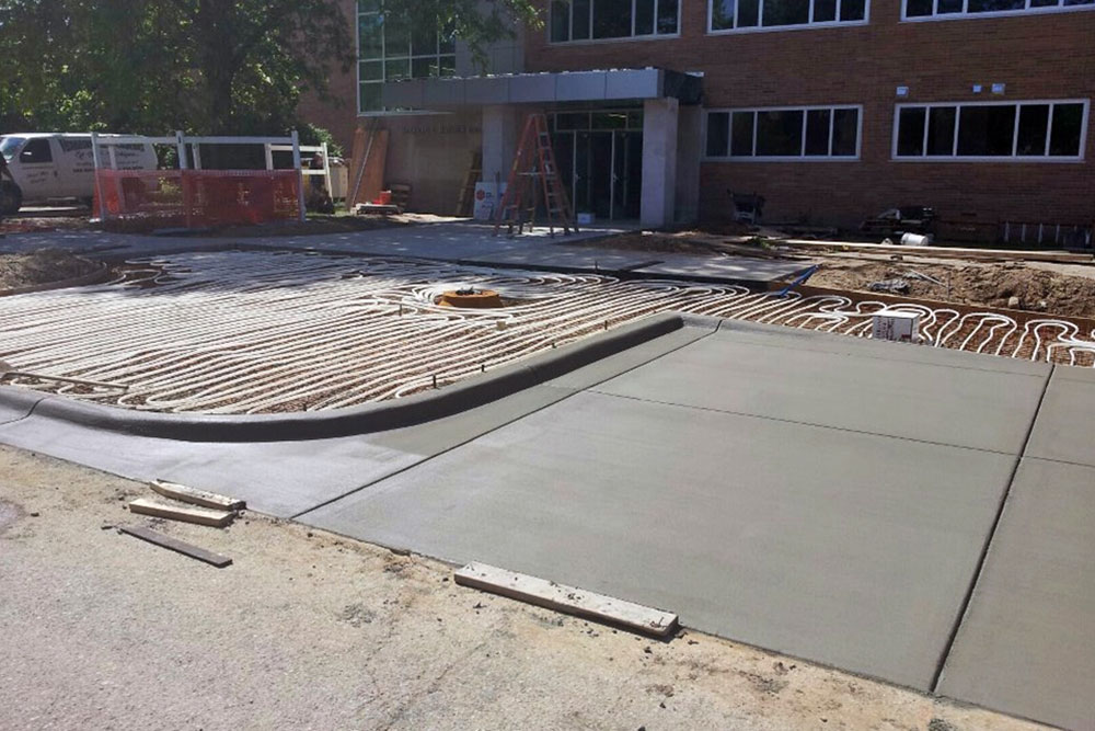Concrete sidewalks, curbsides, basketbell courts and amphitheatre  and  at MSU Bailey Hall by Moore Trosper Construction